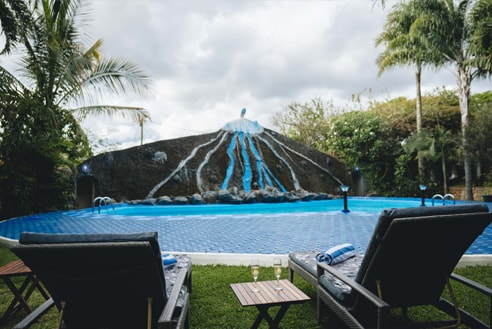 Pool area at Naibor Villa in daylight